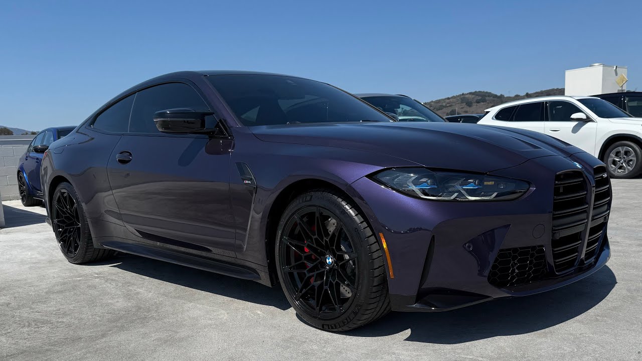 2024 BMW M4 (G82) in Individual Techno Violet Metallic with Fiona red interior.