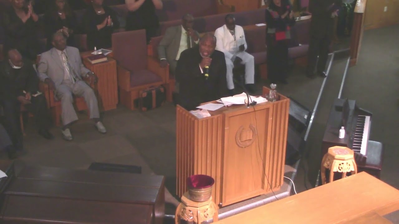 Overseer Kenneth Wilson sings 