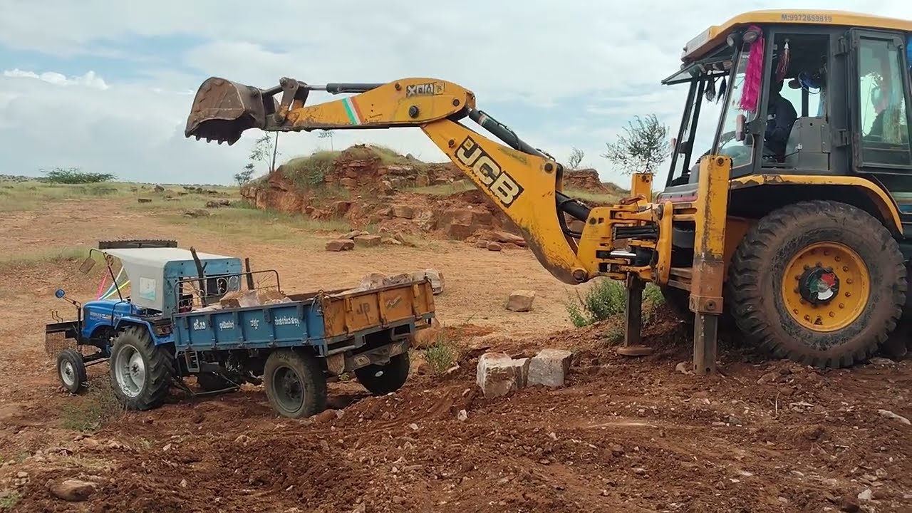 Jcb stone loading to tractor