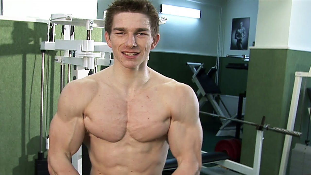 Ripped aesthetic junior bodybuilder - shoulders training