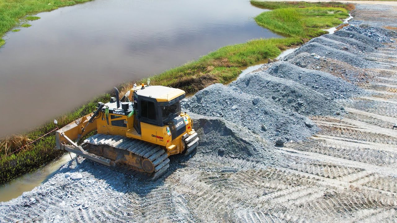 Perfectly Action Strong Bulldozer Moving Mix Stones in Deep Area Spending Long Times For Fill