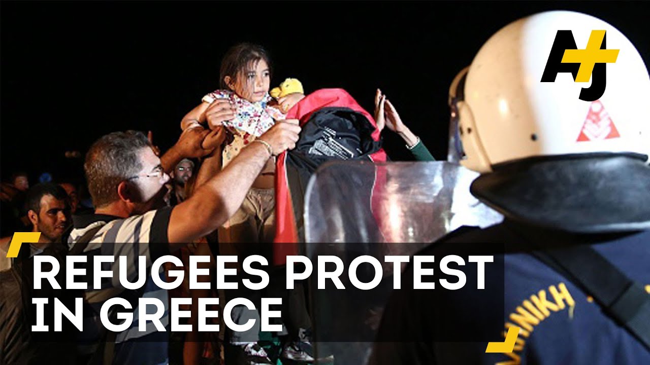 Riot Police Clash With Refugees On Greek Island Of Lesbos