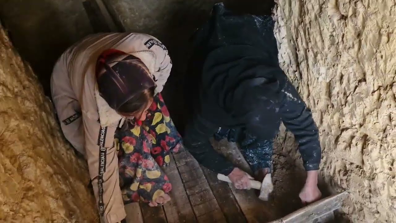 Mother and her pregnant daughter building a cave in the mountains.