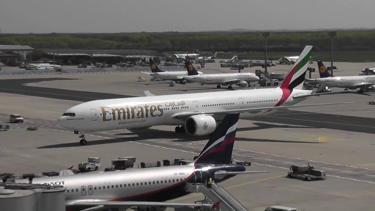 Emirates Boeing 777-36N/ER landing and taxi-in at Frankfurt Airport