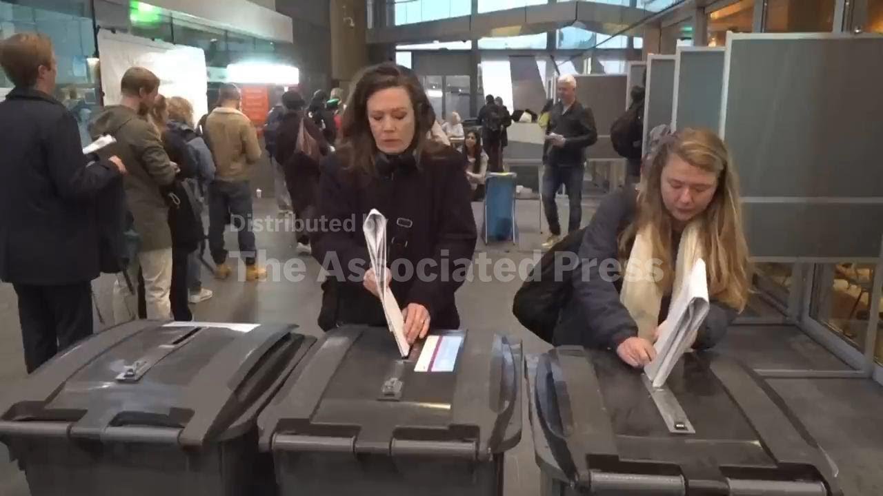 Dutch wrestle with giant paper ballots as they vote in tense snap election