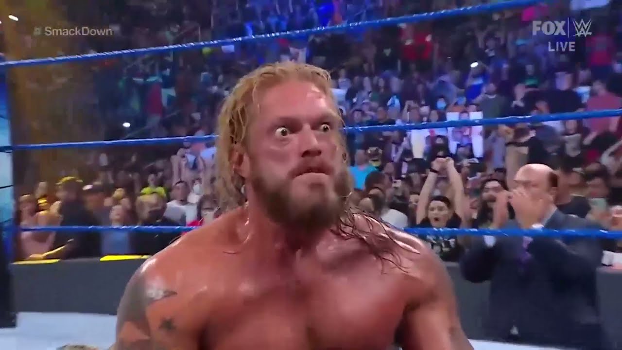 Edge Spears to Roman Reigns