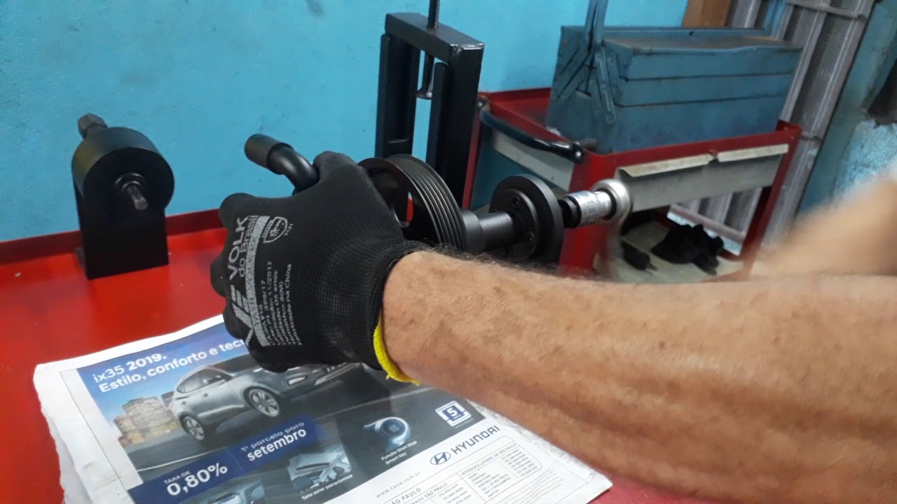 Remover a polia da bomba de direção Hidráulica sem abrir a bomba
