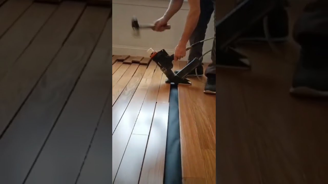 Nailing down Brazilian cherry prefinished wood floor.