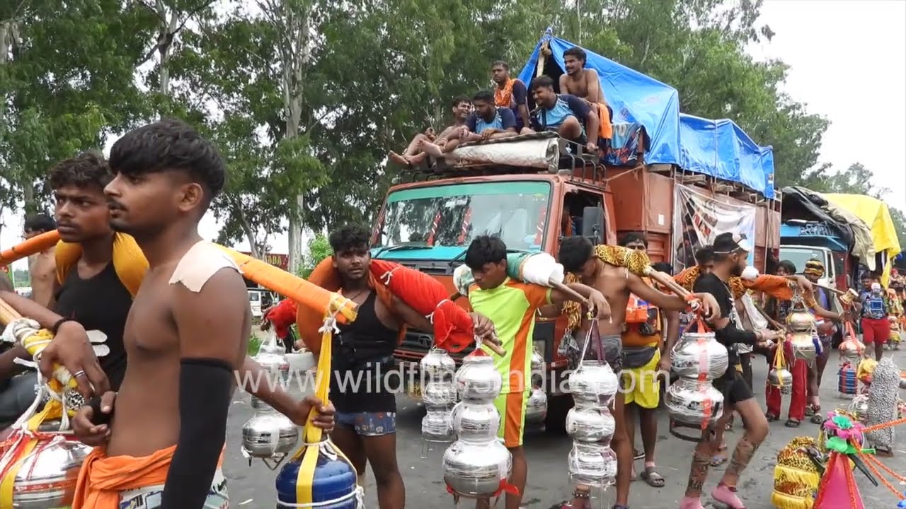 Kanwar yatri walk along the roads of Haridwar during the Kanwar Yatra