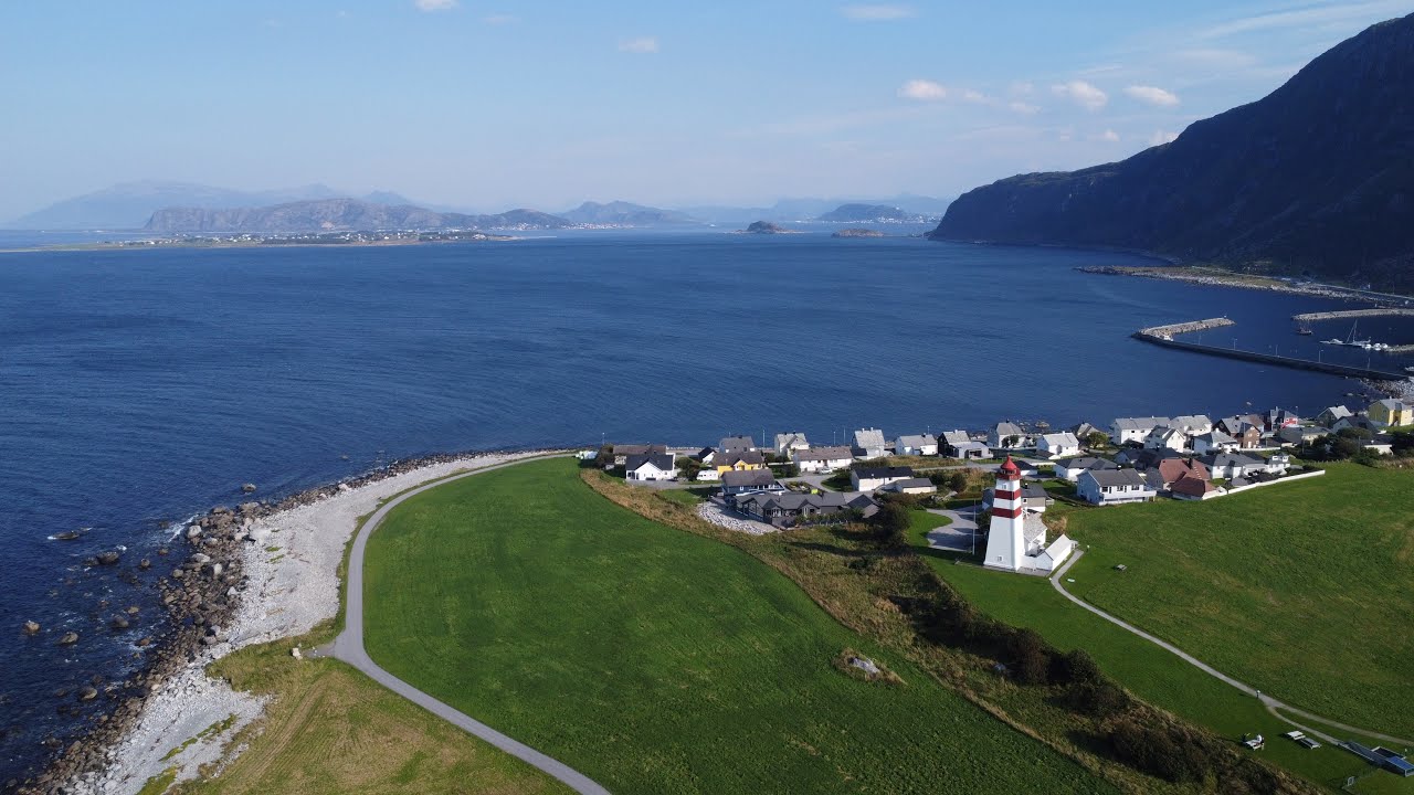 Alnes fyr (Alnes Lighthouse) - scenic landscape near Ålesund filmed by drone