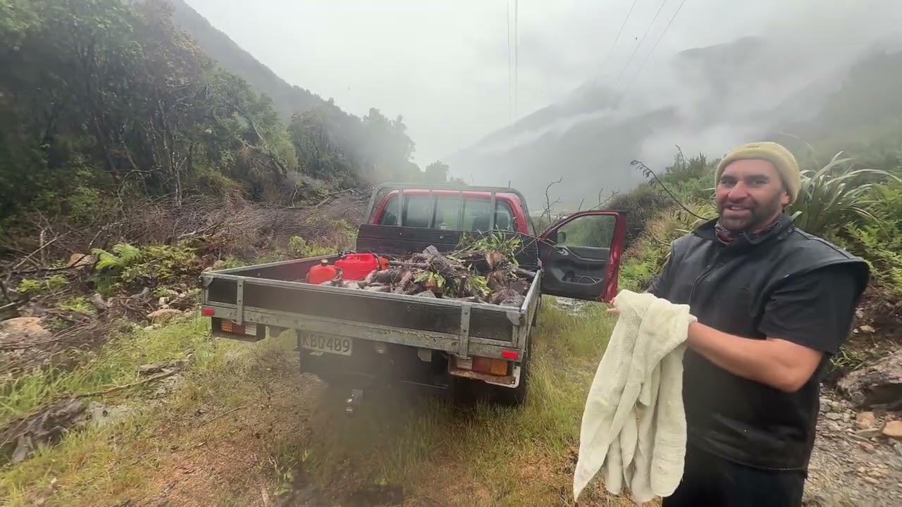 Otira needs firewood, so it’s time to get stuck in, pulling out logs and  wood in the pouring rain.