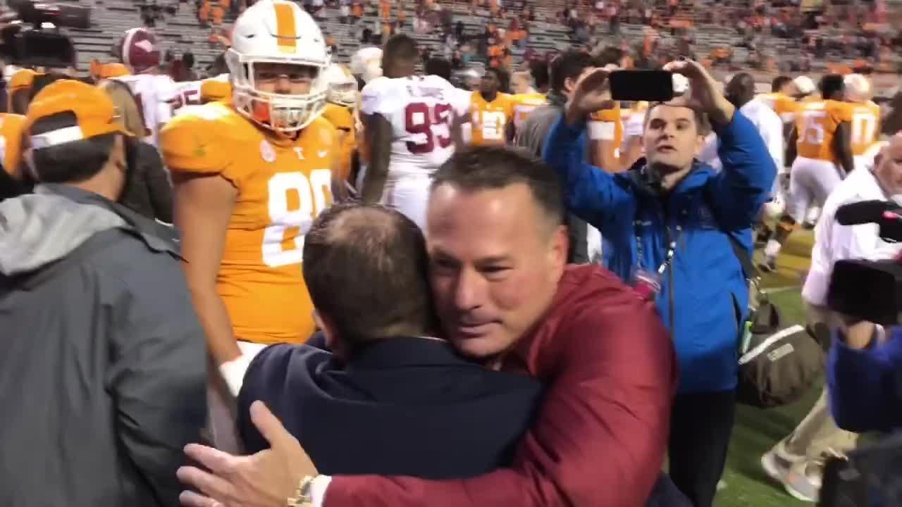 Butch Jones greets former Tennessee players after Alabama win