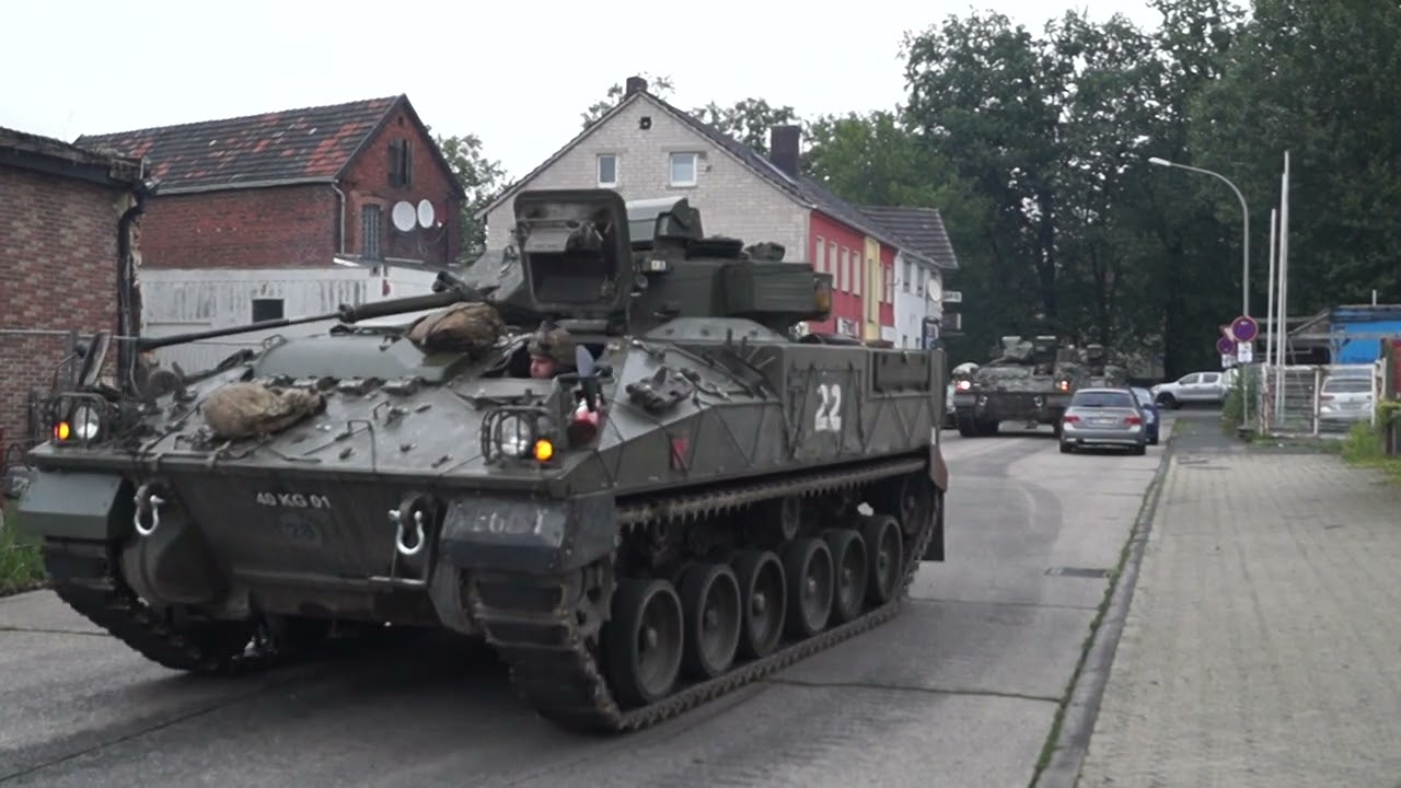 Warrior Fv510 tracked armored vehicles drive to the loading dock