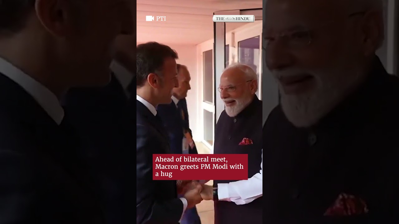 Ahead of bilateral meeting, French President Emmanuel Macron greets PM Modi with a hug