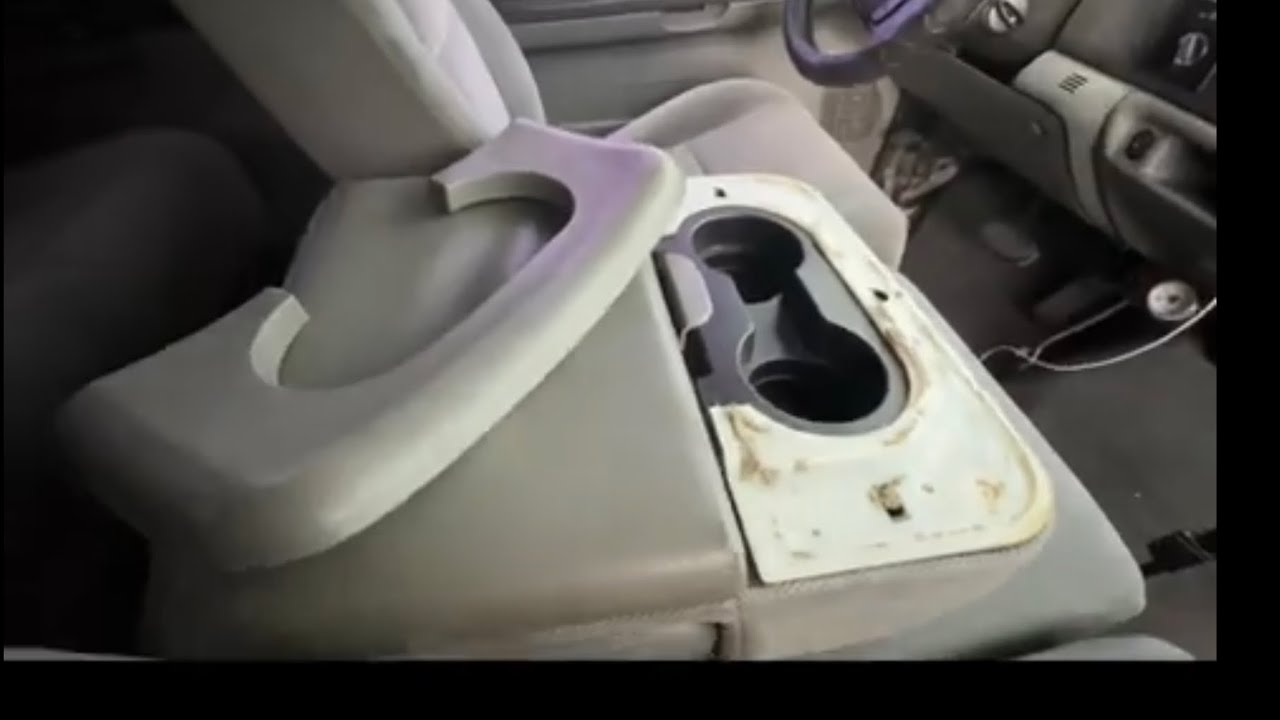 How to Replace the Center Console Cupholder Armrest Pad on a Ford F250 / F350.