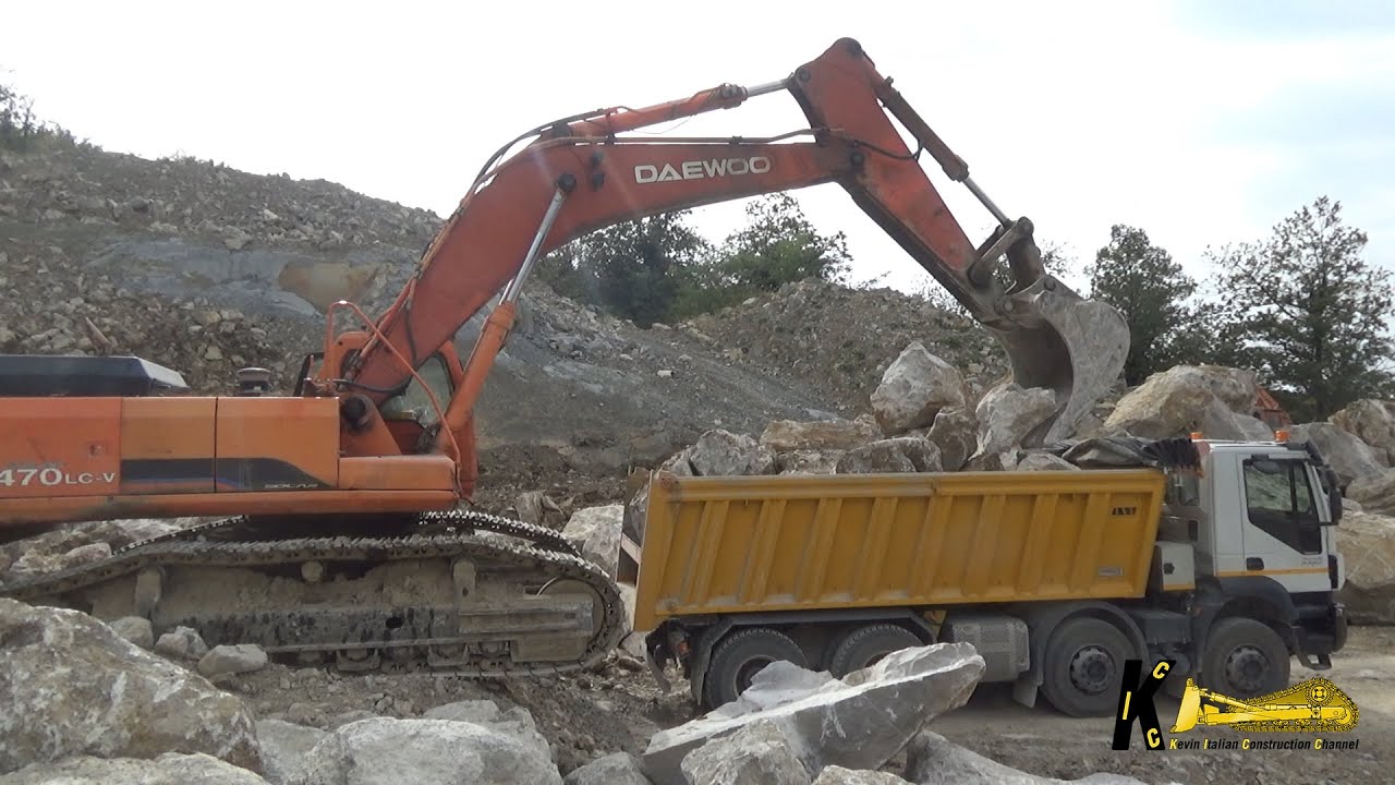 OLD DAEWOO S500 EXCAVATOR LOADING BIG ROCKS ON TRUCK #heavyequipment #excavator #digger #truck