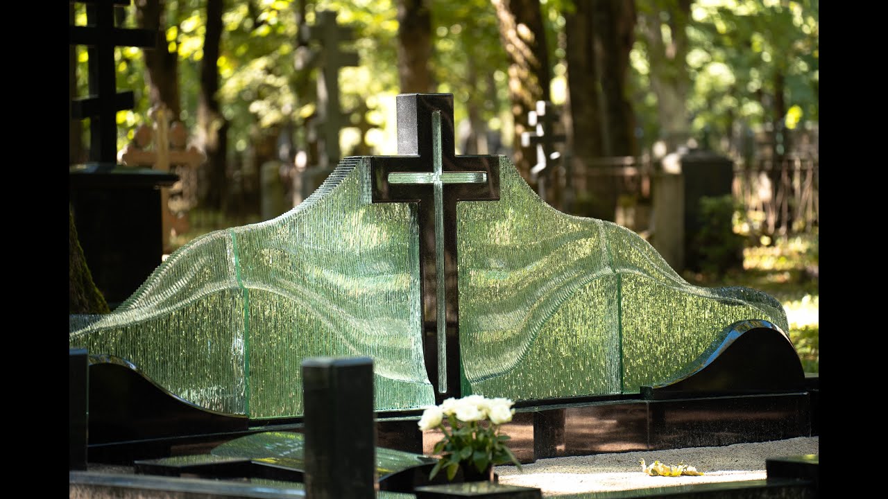 Large family monument in the cemetery &ndash; black granite cross and glass waves by Glasstone.eu