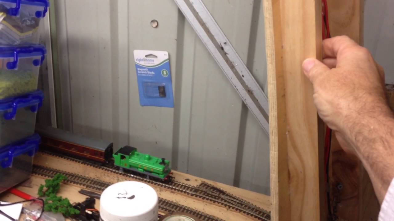 Hinged entrance section on model railway