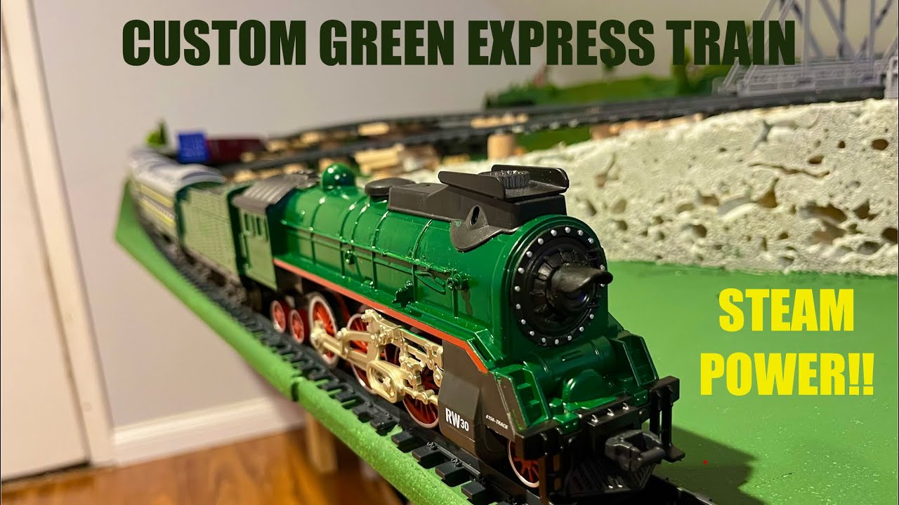 Elegant Green Express Train pulling elegant passenger cars w/ Steam Power