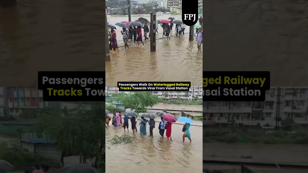Passengers Walk On Waterlogged Railway Tracks Towards Virar From Vasai Station