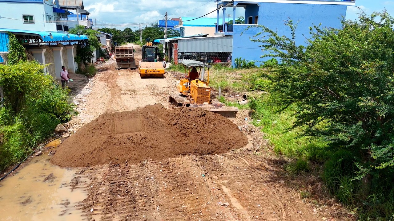A Clean Project Landfill On Water Making Road Village by Dozer D31P With Truck