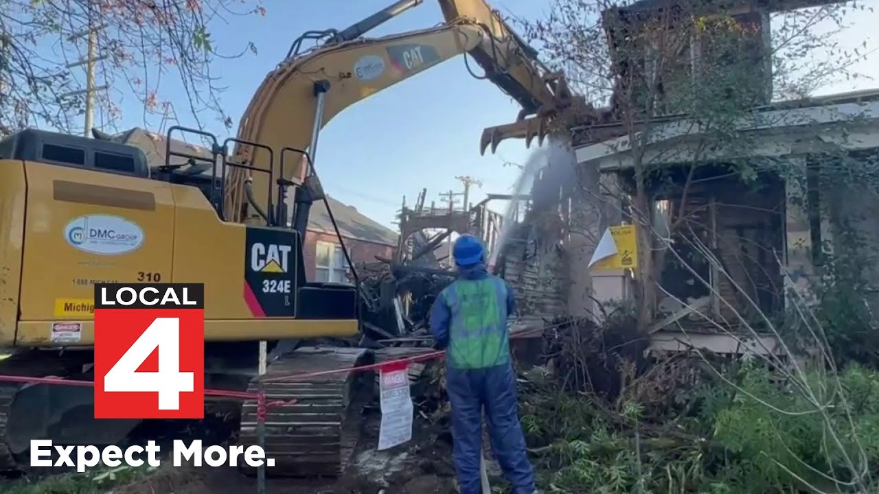 Demolition crews knock down vacant Detroit house after fire spreads to neighboring homes