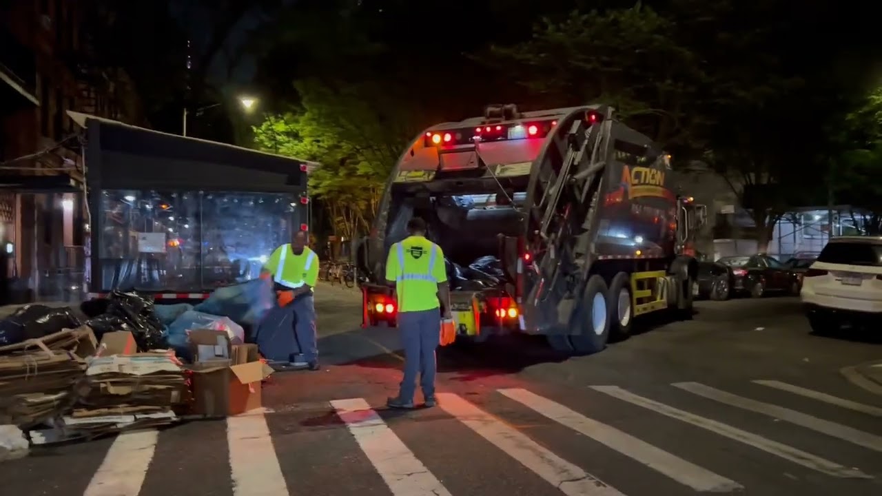 Action Carting Garbage Truck Packing NYC Trash Piles