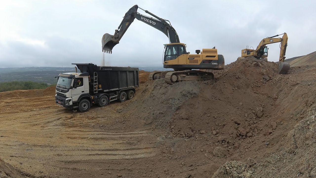 Excavator Volvo EC380D loads trucks #10