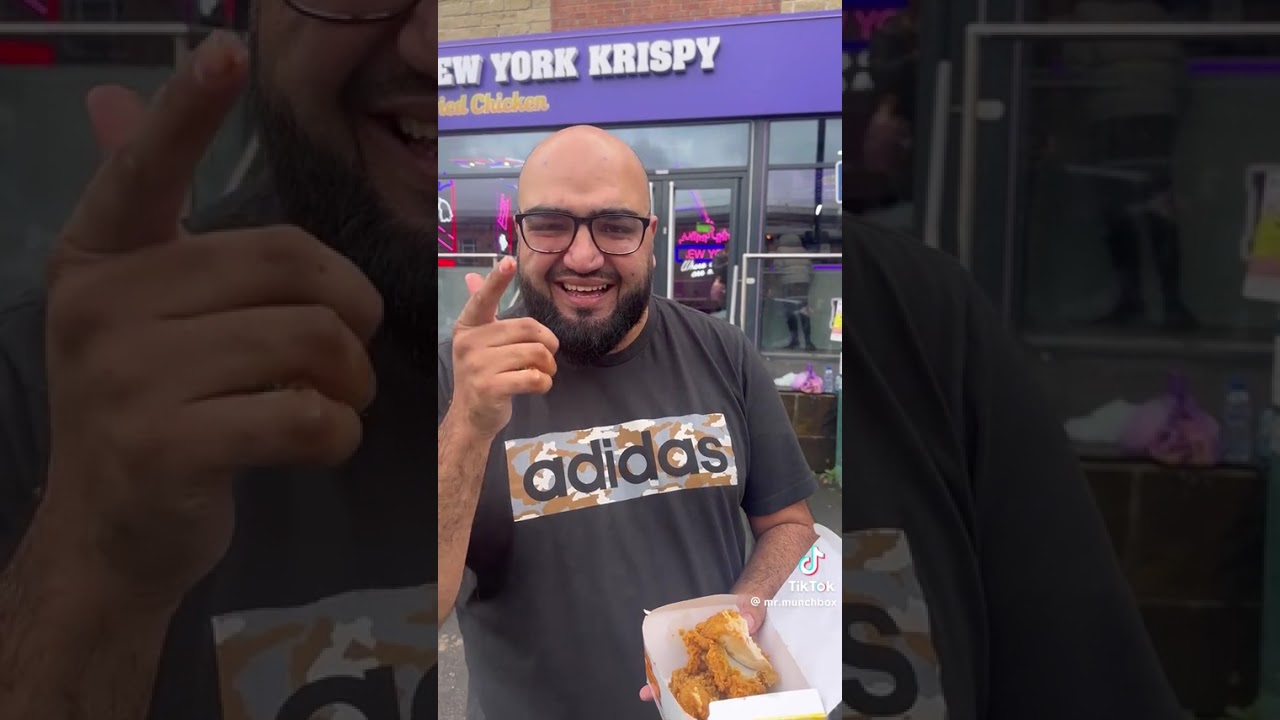 This guy taking about the spicy dip burger at New York crispy restaurant 