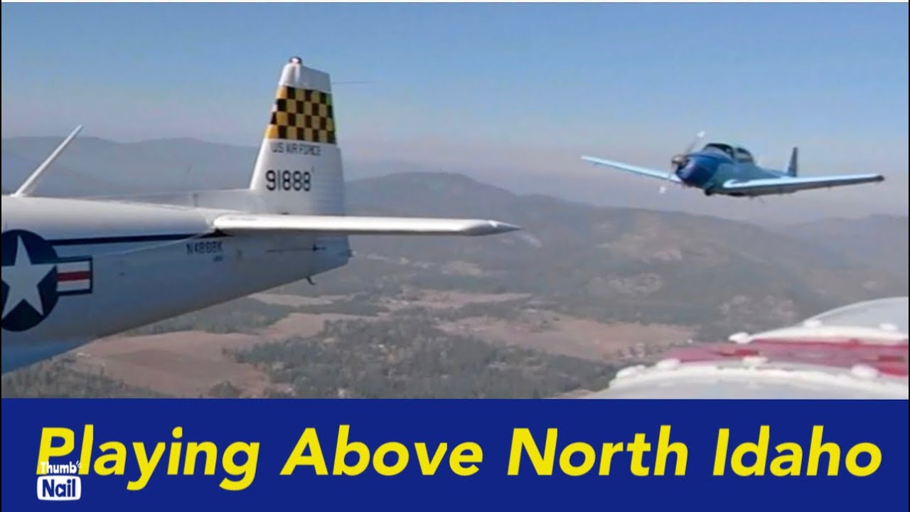Two Navion airplanes playing over North Idaho