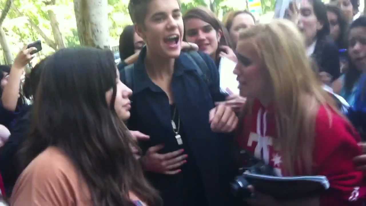 Justin Bieber with fans leaving the Ritz hotel in Madrid