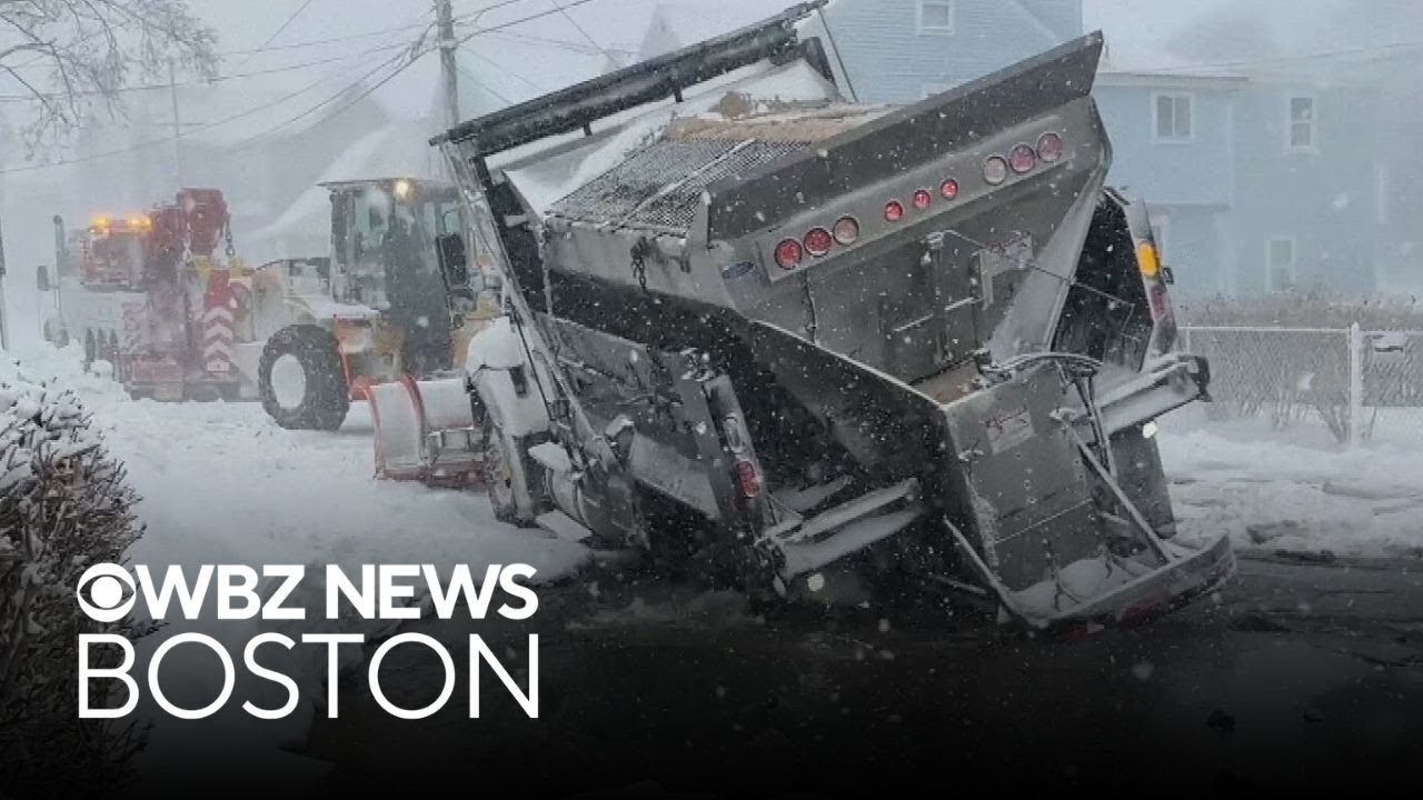 Plow truck gets swallowed into sinkhole during blizzard in Massachusetts