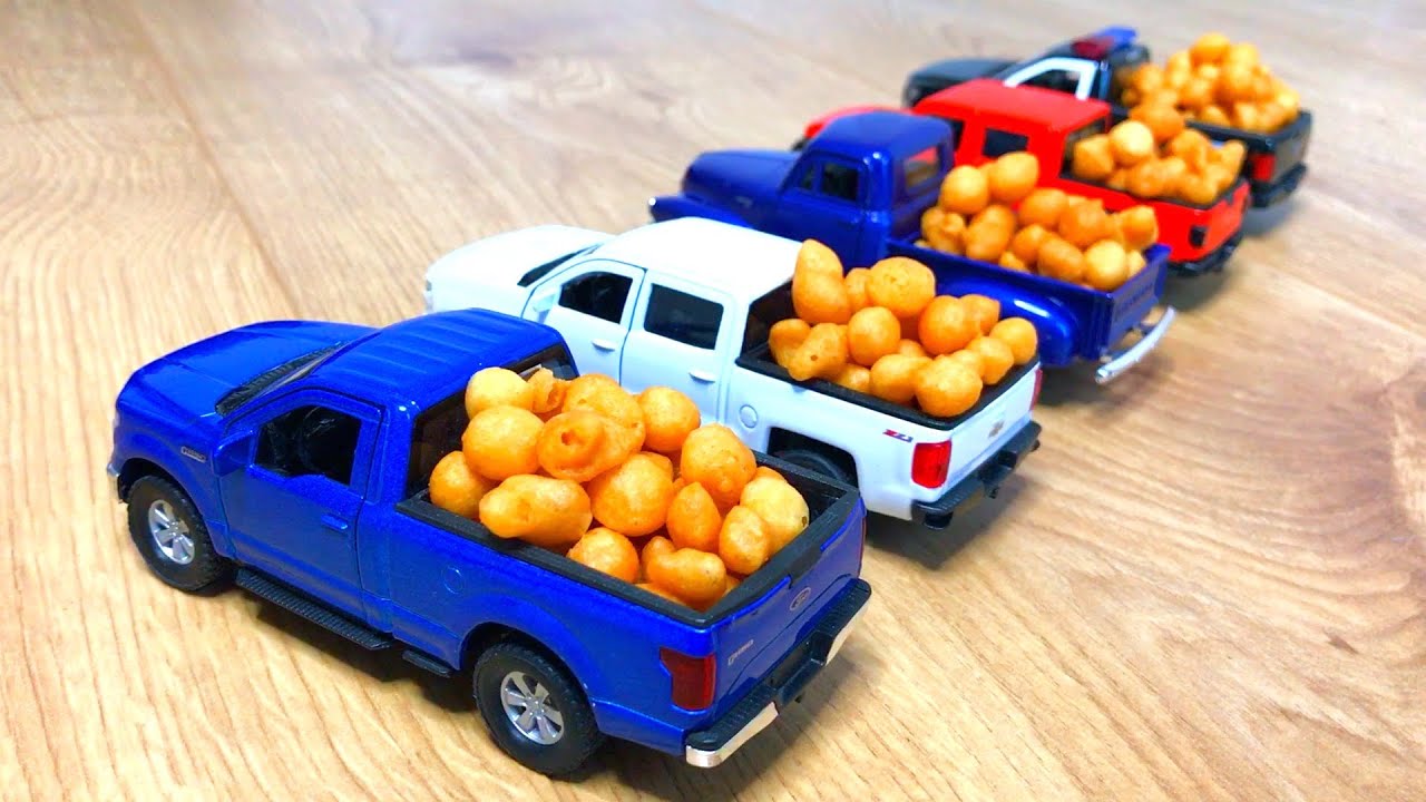 Diecast model cars Pickup Trucks carrying yellow balls by Bibi Cars