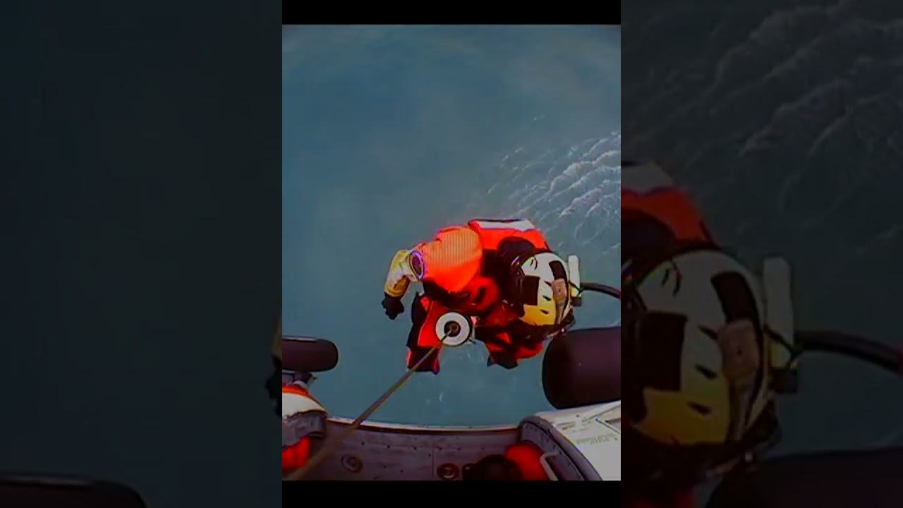 A Coast Guard Sitka MH-60T Jayhawk aircrew rescue three survivors (fishermen) near Kayak Island