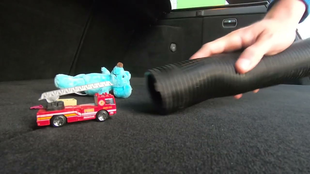 Vacuuming out the car at the gas station after holidays