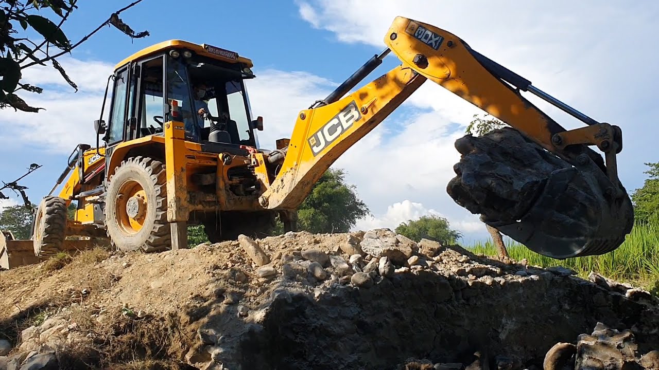 JCB Earth Movers Breaking Old Concrete Bridge and Throwing Out Stone - JCB 3dx eco Backhoe Loader