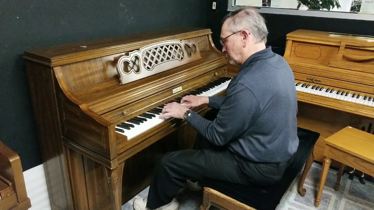 Kimball walnut console piano at Piano Trends Music