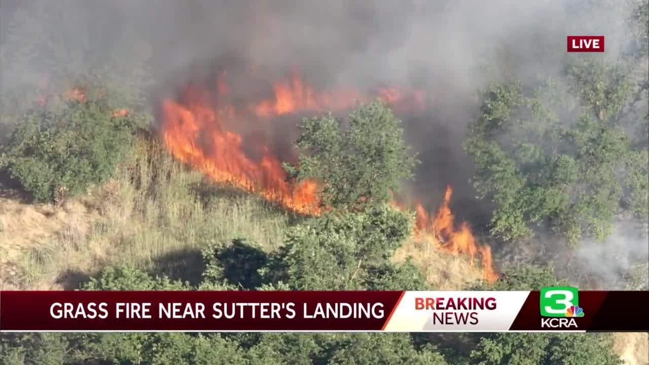 Crews battle vegetation fire near Sutter's Landing
