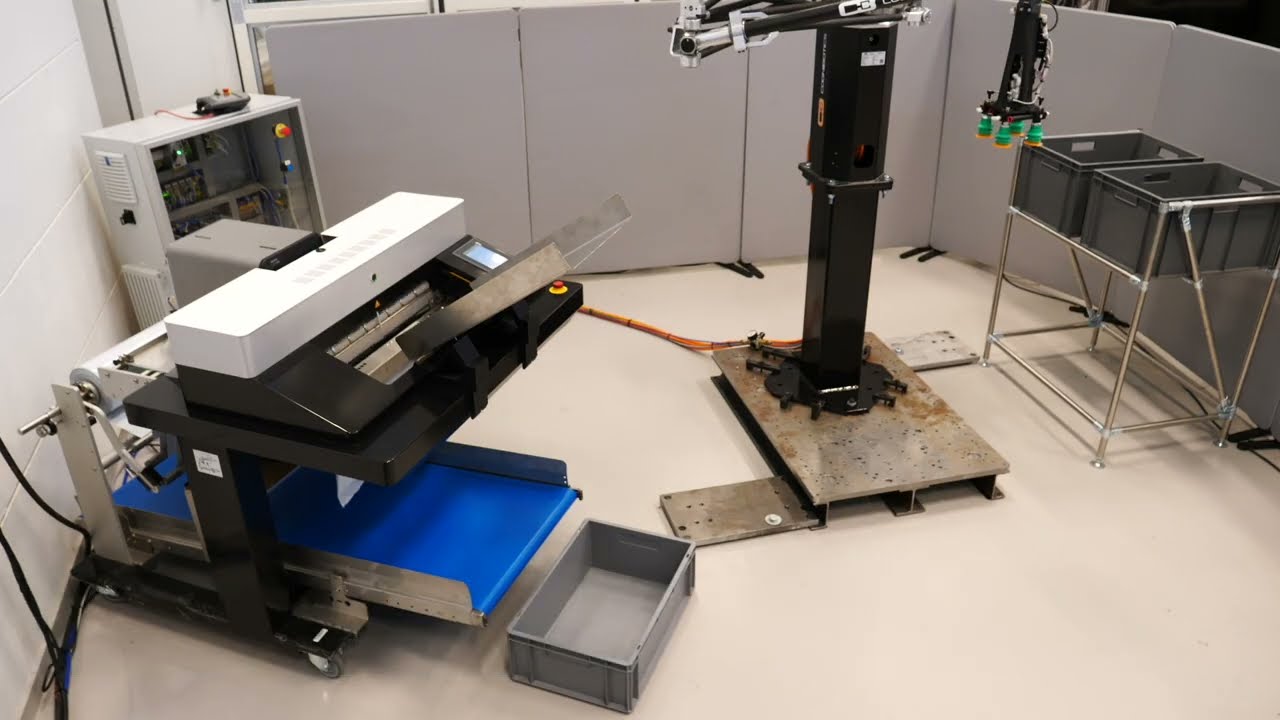 Robotic Feeding  of Apparel into Poly Mailers - Rollbag R3200XL Fulfillment Auto Bagger