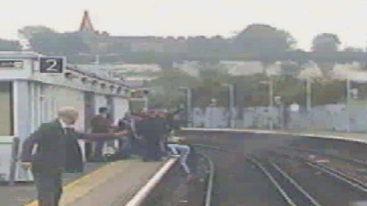 Dramatic: Man jumps onto railway track to save woman from oncoming train