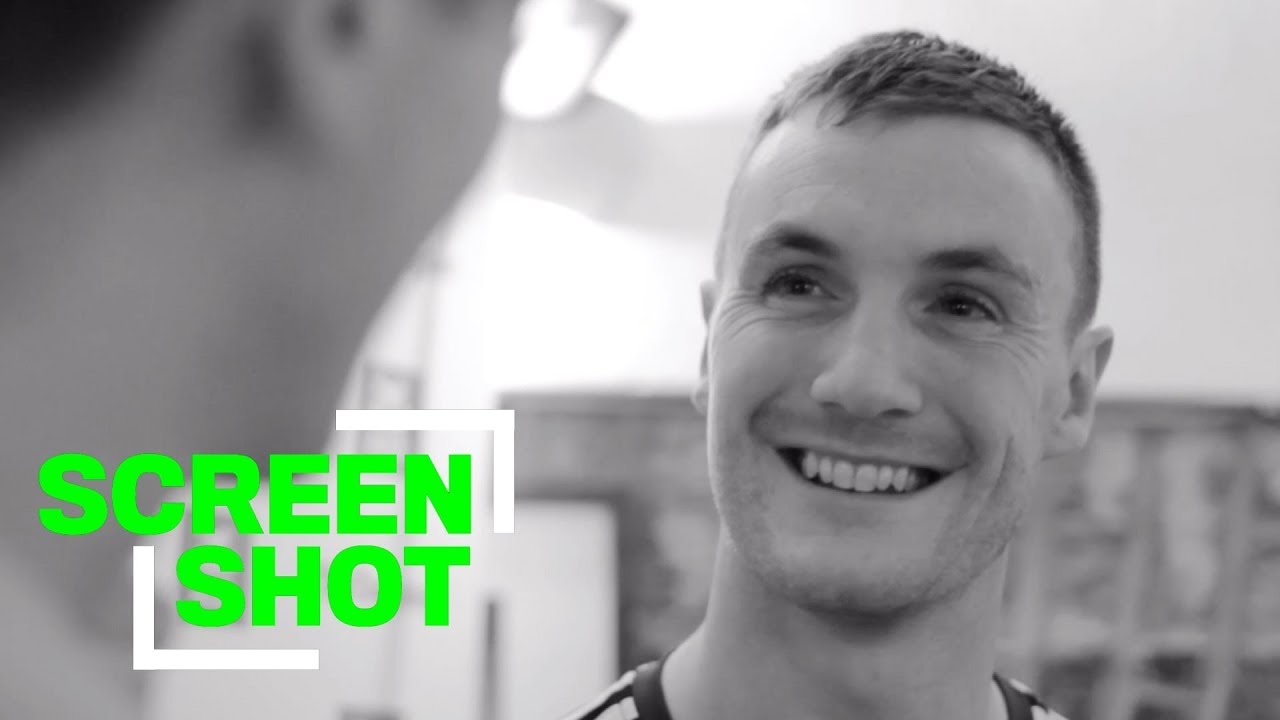 Leo McLoone looks at pictures of himself | Screenshot | Episode 1