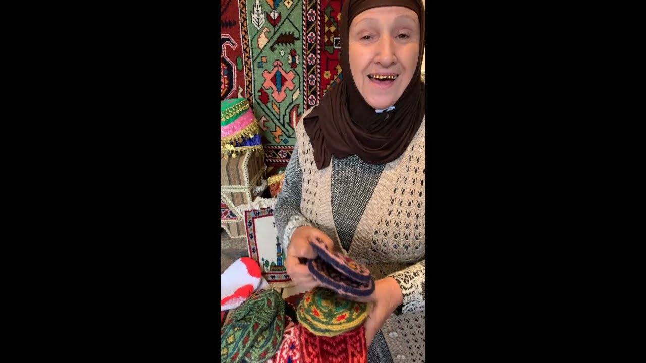 Suliye from Lahij Azerbaijan talks about her slippers made from her own spun yarn.