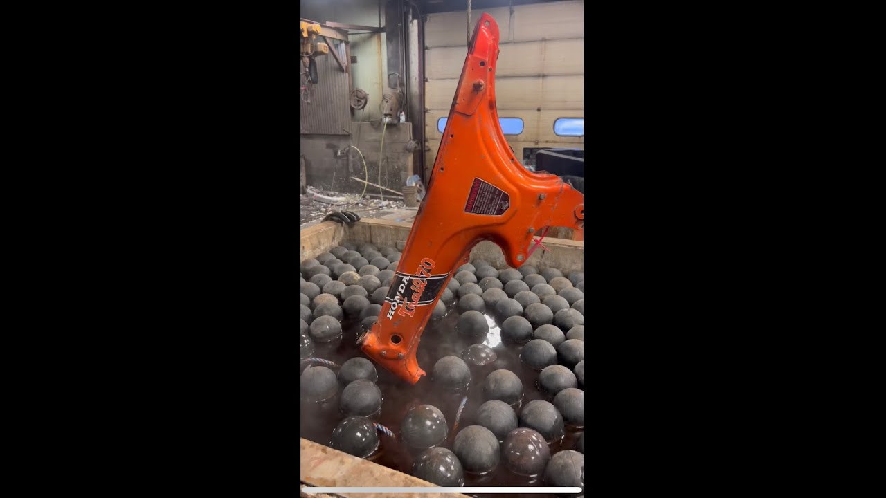 Chemical dipping a Honda Trail 70 motorcycle