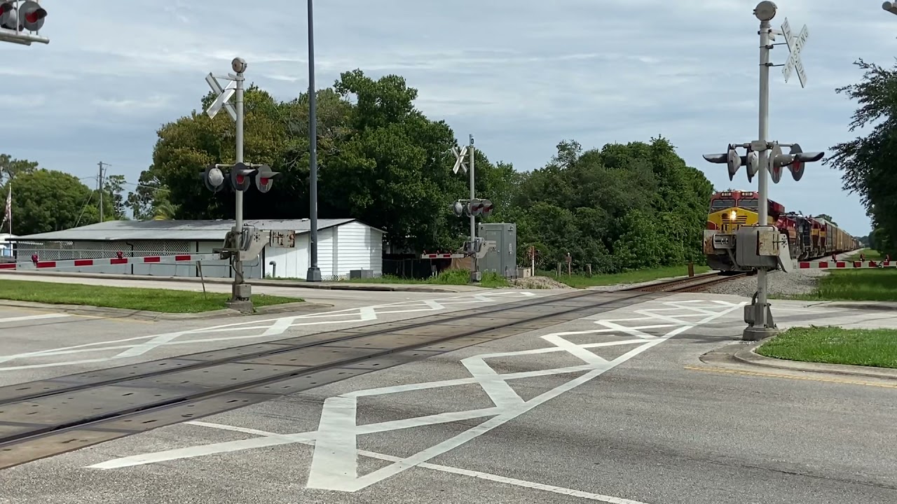 FEC Southbound mixed freight moving through Port Orange, FL. (07/05/2021)