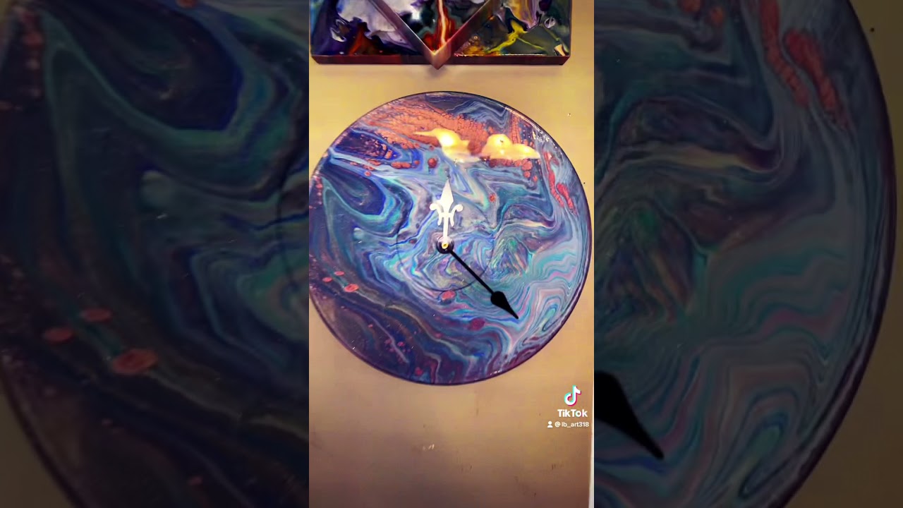 My new fav clock! Acrylic pour over vinyl record, sealed with resin.