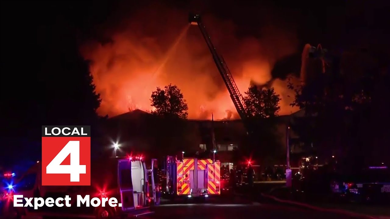 Multiple firefighters working to put out massive fire at an assisted living facility in Southgate