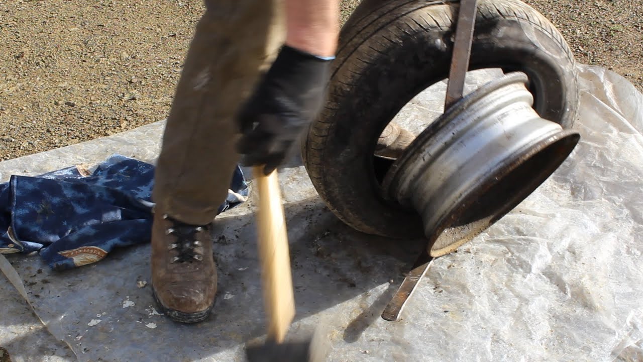 How to change a car/truck tire in 5 minutes using a garden spade.