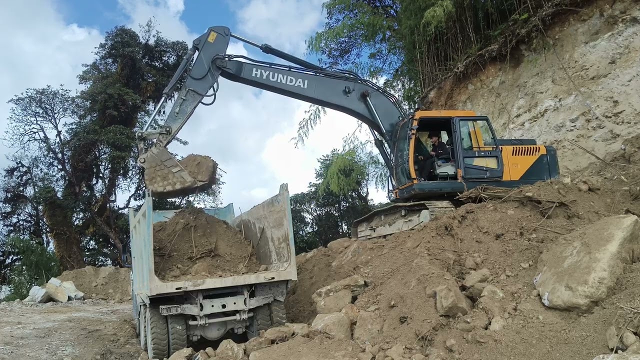 Excavator machine top loading