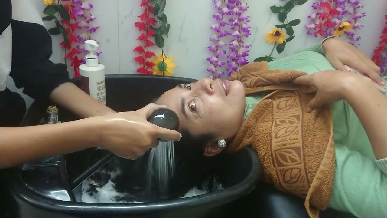 Cleaning Hair service in the salon with window washing soap with clean water.