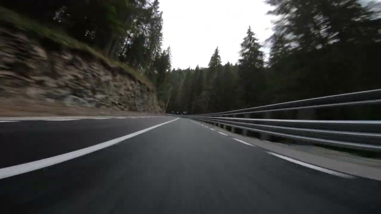 Fast Honda S2000 on a damp mountain road